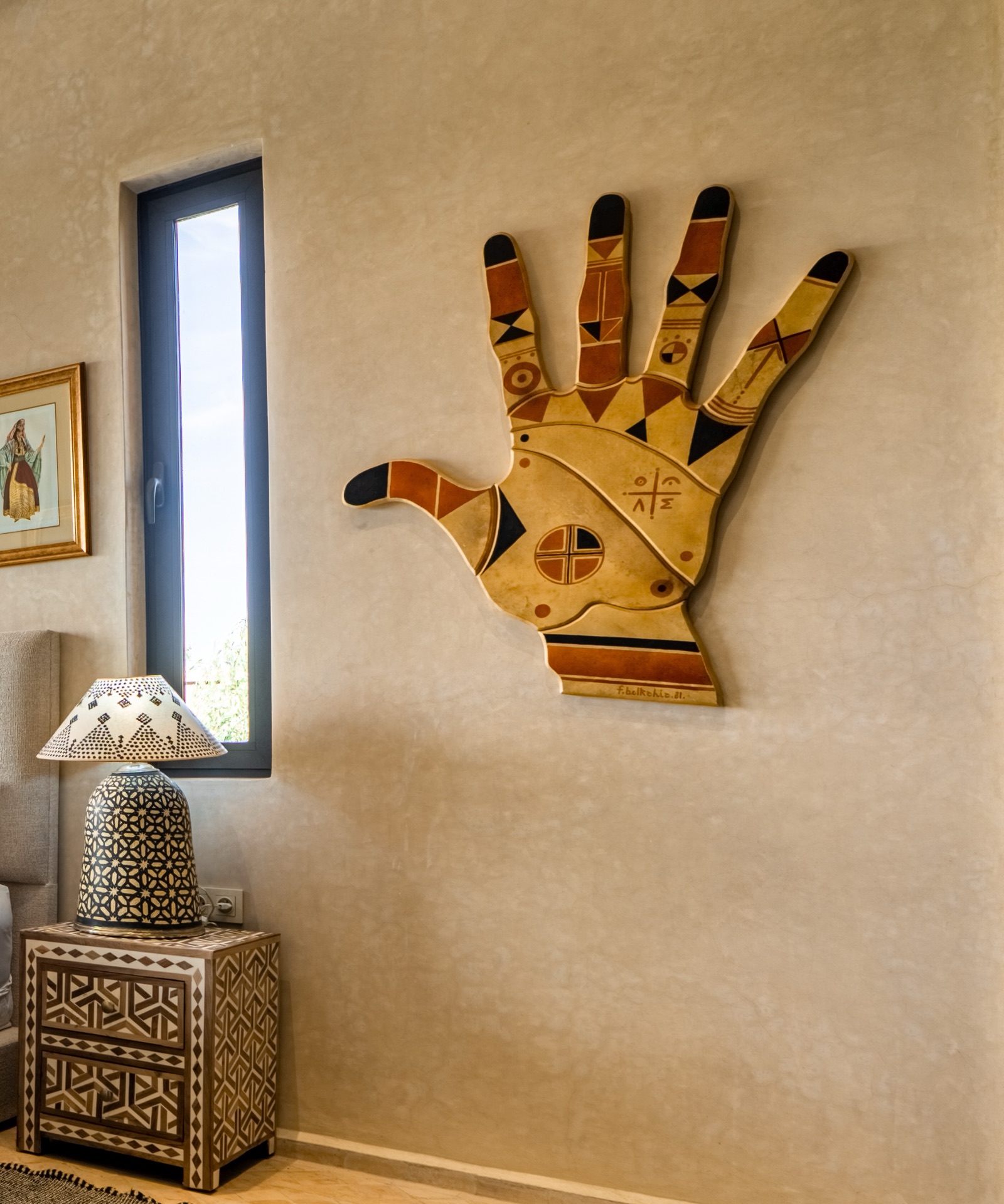 A hand-painted khamsa on the wall of a suite