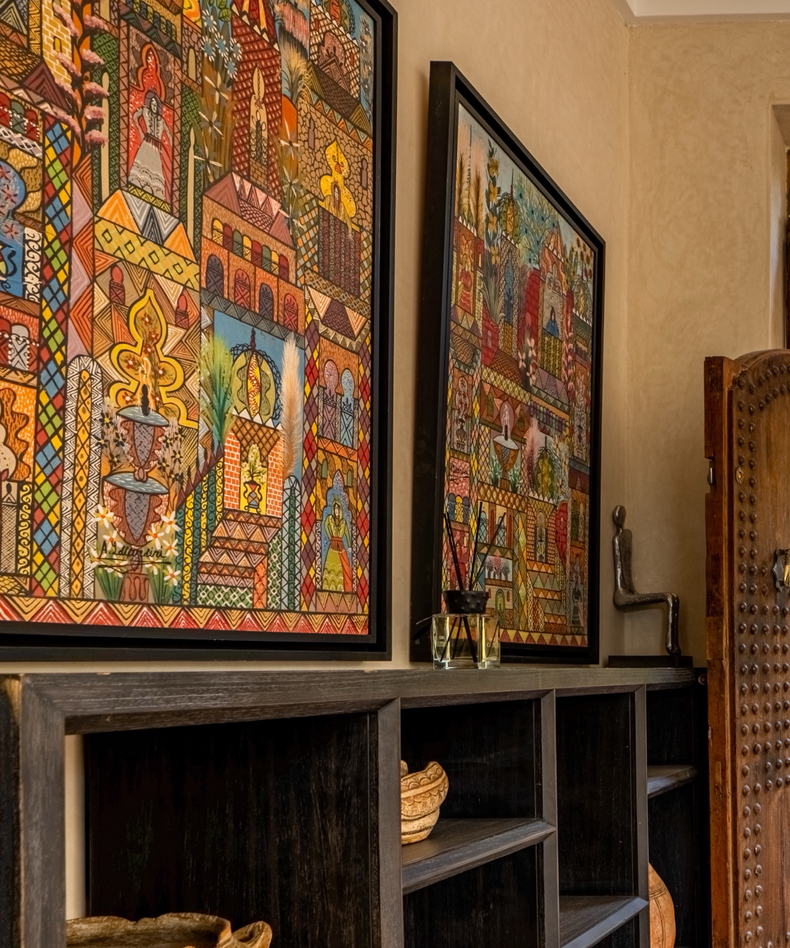 Colourful Moroccan paintings by the entrance