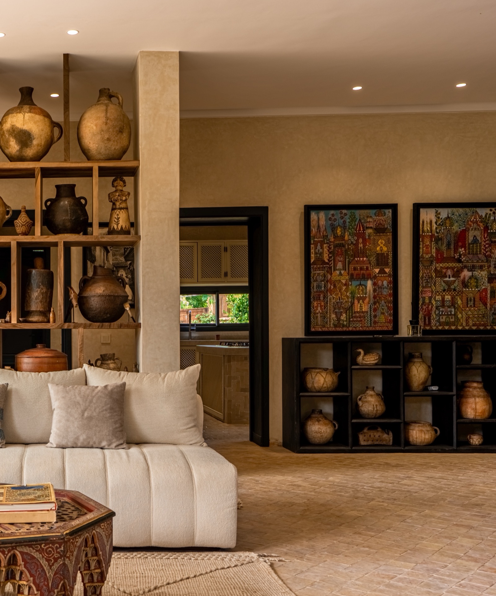 Pottery shelves and paintings in the lounge