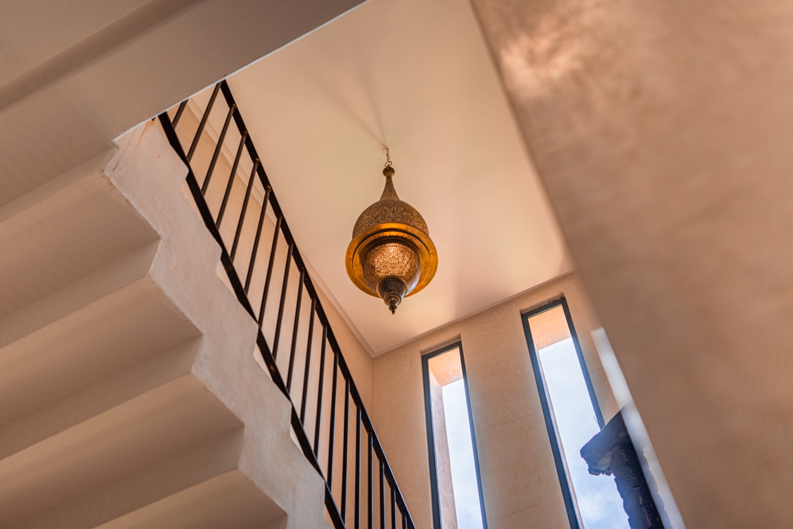 A brass lantern above the staircase