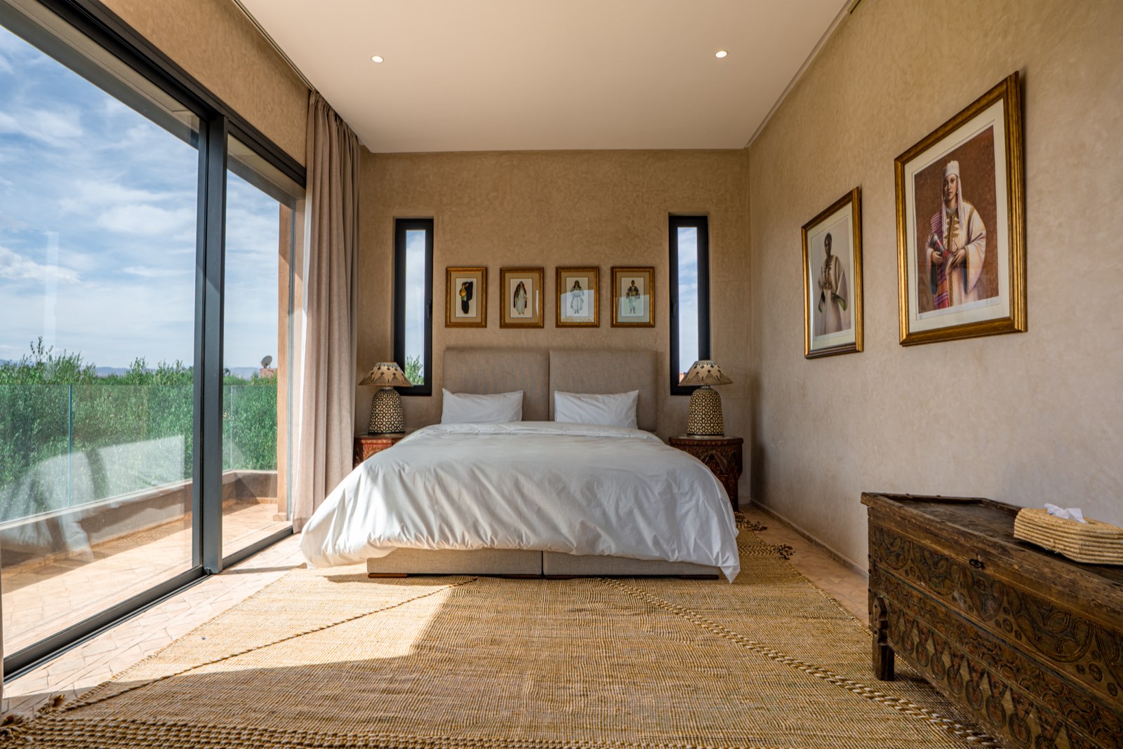 The king-size bed of Suite One facing the balcony