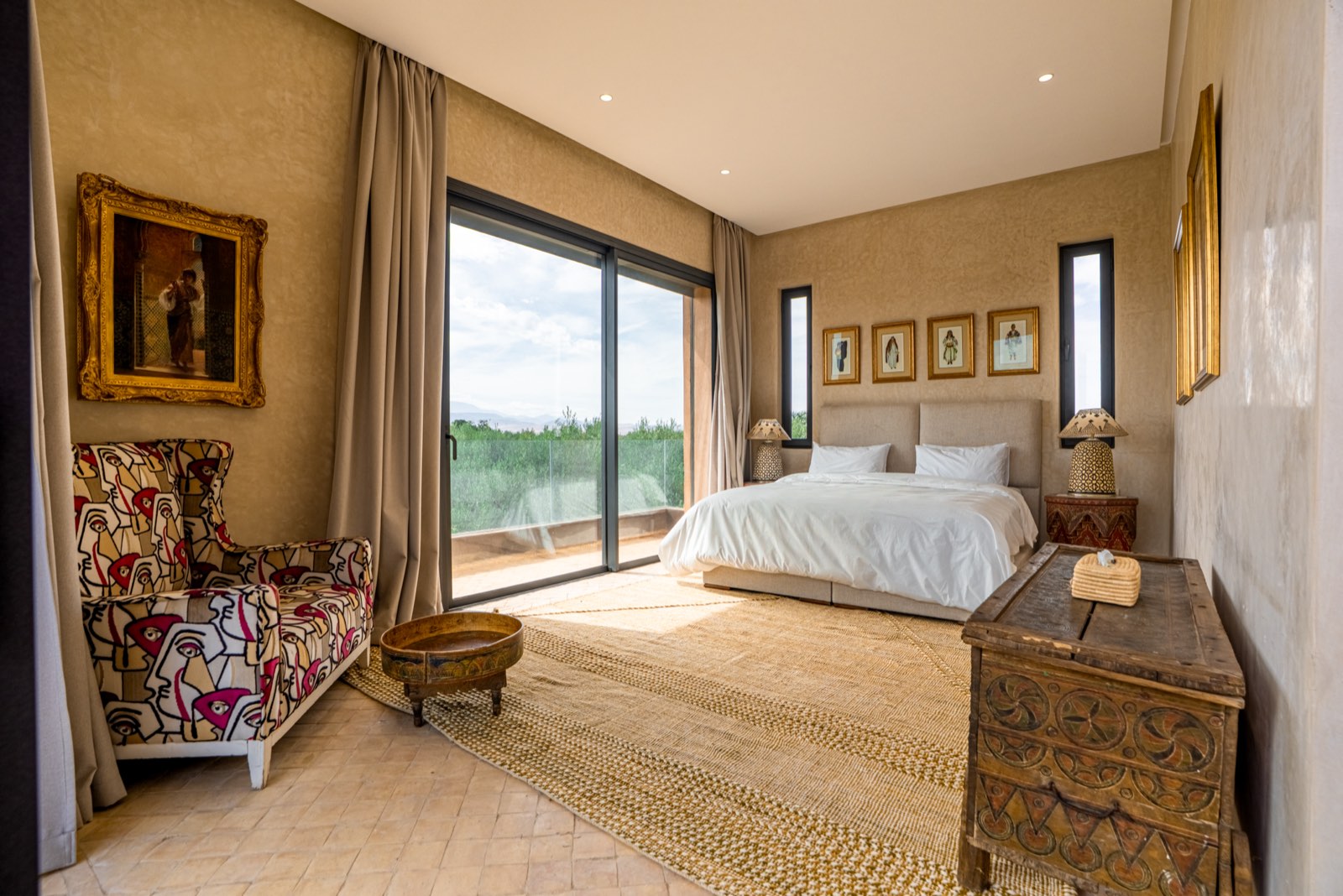Suite One: king-size bed and wide windows onto the balcony